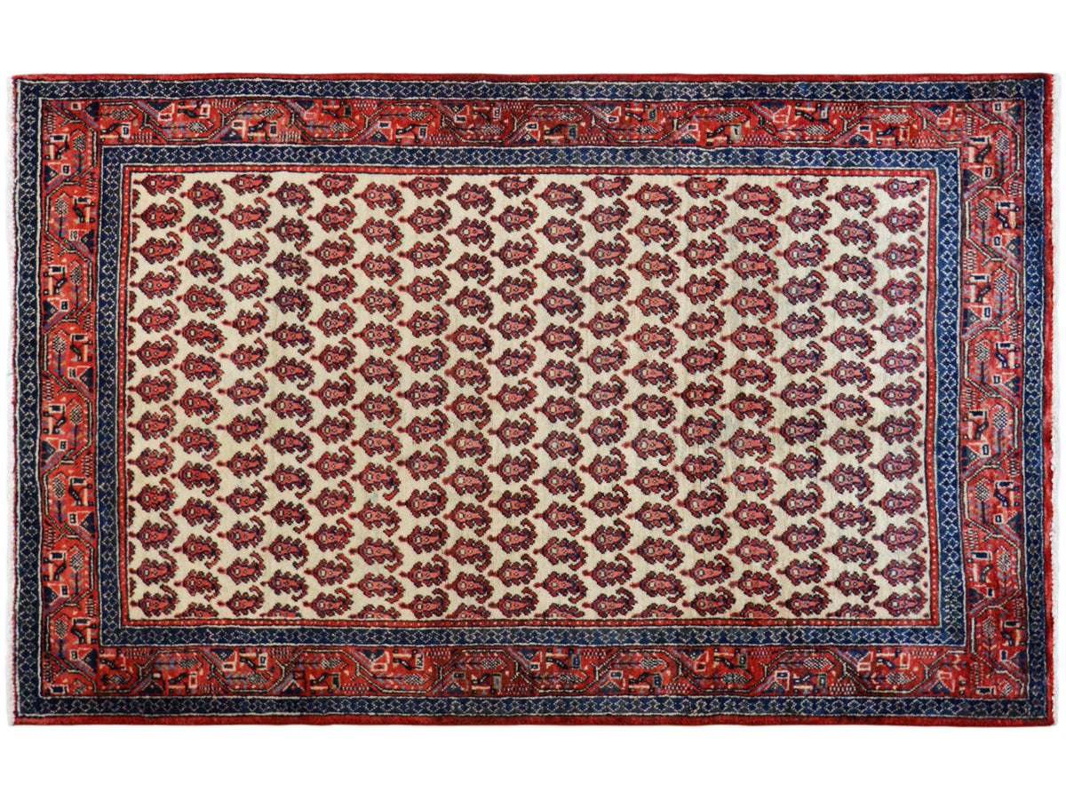 Rectangular rug: cream-colored field with a red border and dark blue edging