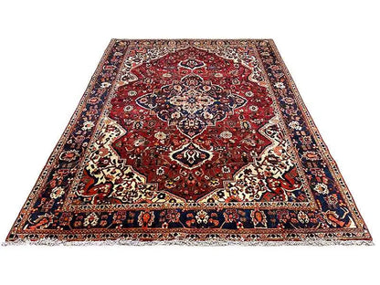 Bakhtiari rug (306x207 cm) lying flat: red central medallion, multicolored border