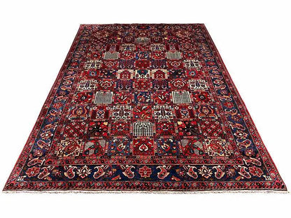 Bakhtiari carpet (319x219 cm) overall view: bold patterned fields and borders in red and blue