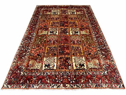 Oriental rug in a quatrefoil design with repeating motifs in red, cream, and dark brown