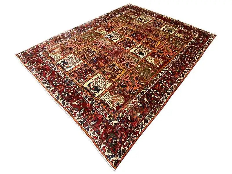 Oriental rug laid out with richly decorated fields in red, brown, beige, and green