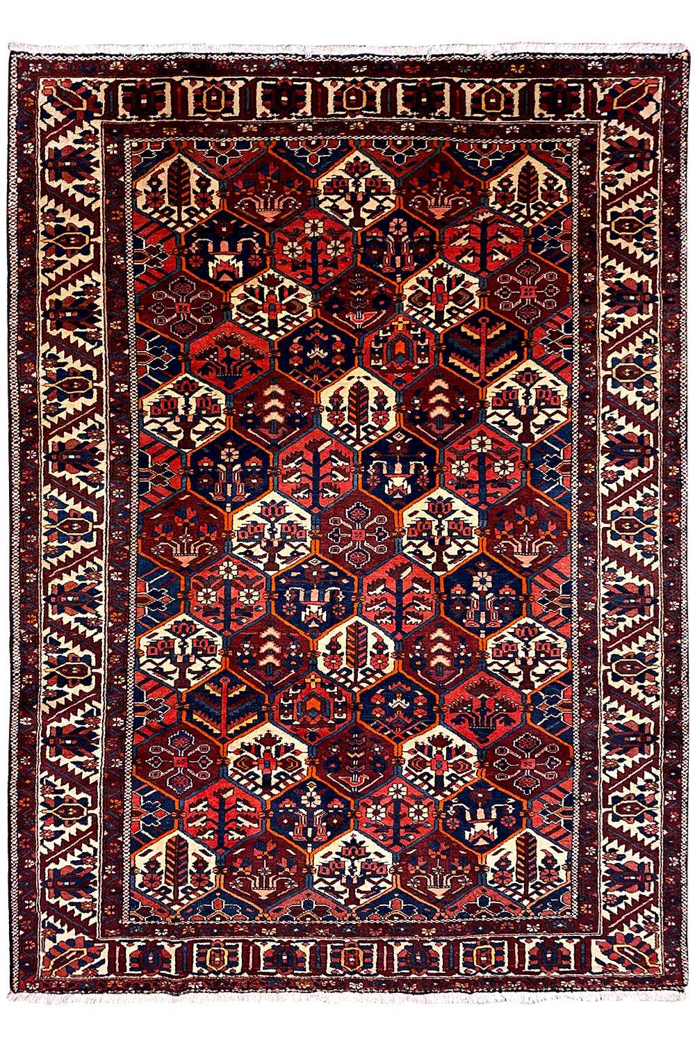 Persian rug with a symmetrical central motif and borders, dark red, blue, beige