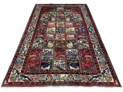 Flat Oriental rug with a dark field, light border, and patchwork motifs