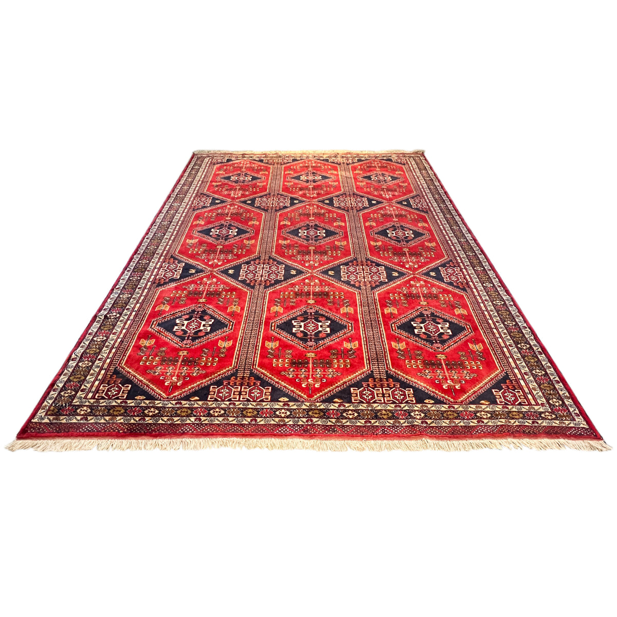 Baluch rug, red checkerboard medallion pattern with dark blue border lines