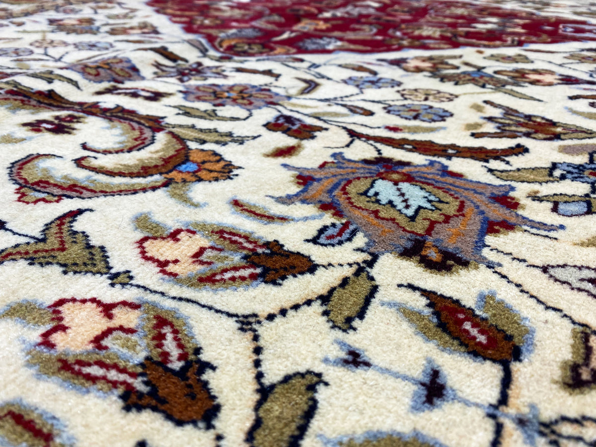 Baluch rug detail, motifs in cream, red and blue
