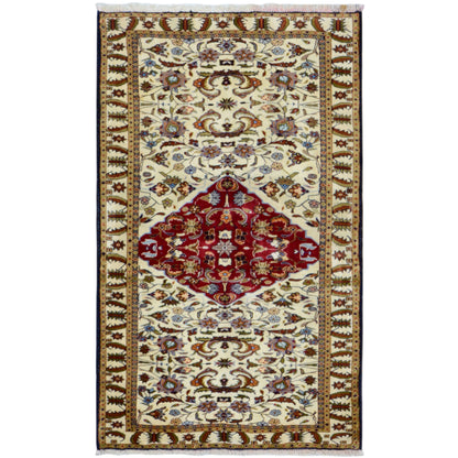 Baluchi rug in an oriental pattern, cream-colored with a red central medallion