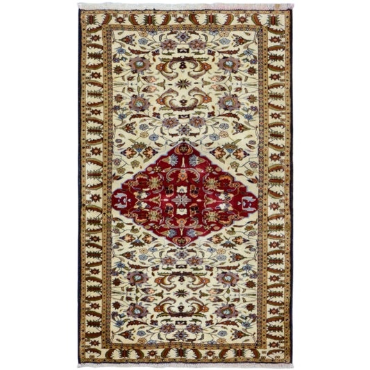 Baluchi rug in an oriental pattern, cream-colored with a red central medallion