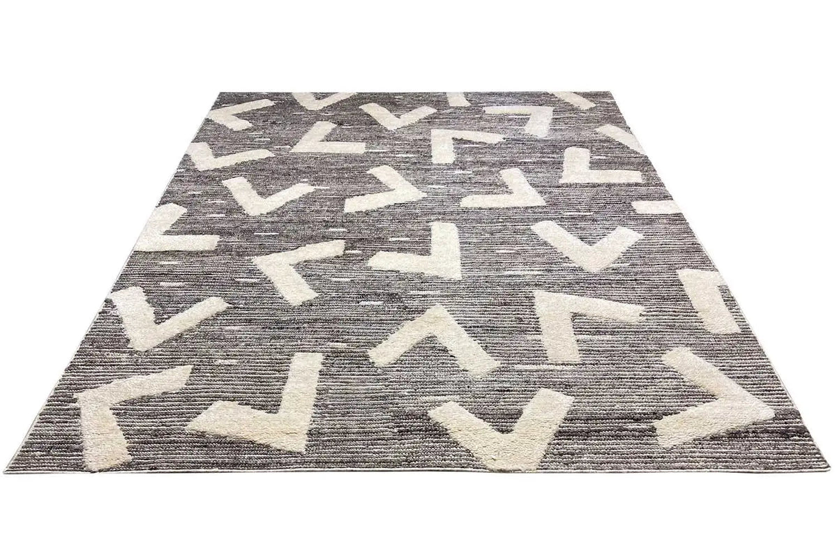 Berber rug with a geometric hooked zigzag pattern in gray and white, rectangular