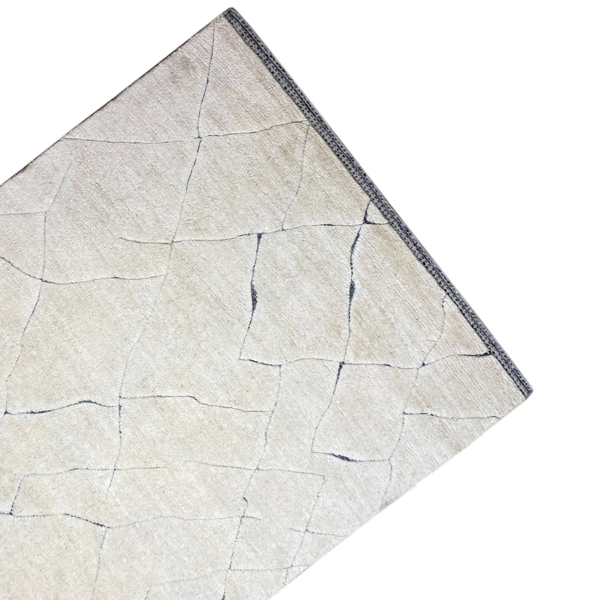 Flat rug in light cream with fine blue lines and a decorative border