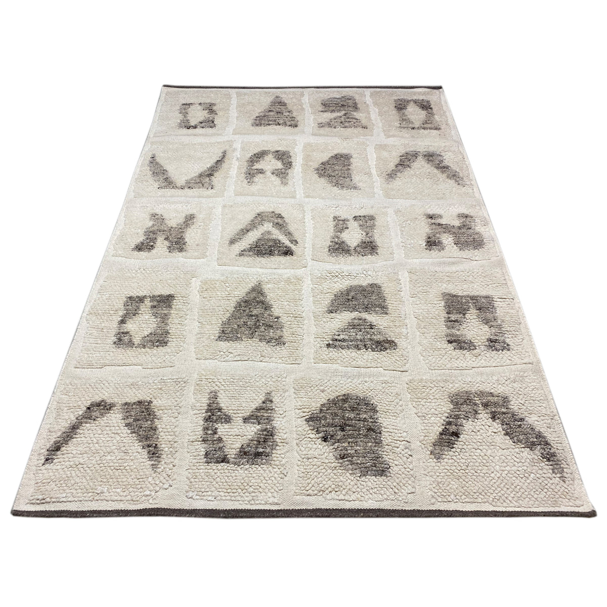 Berber rug with a beige base, rectangular, black-gray tribal pattern in panels