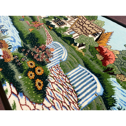 Tapestry detail view with flower beds, stream, and paved path