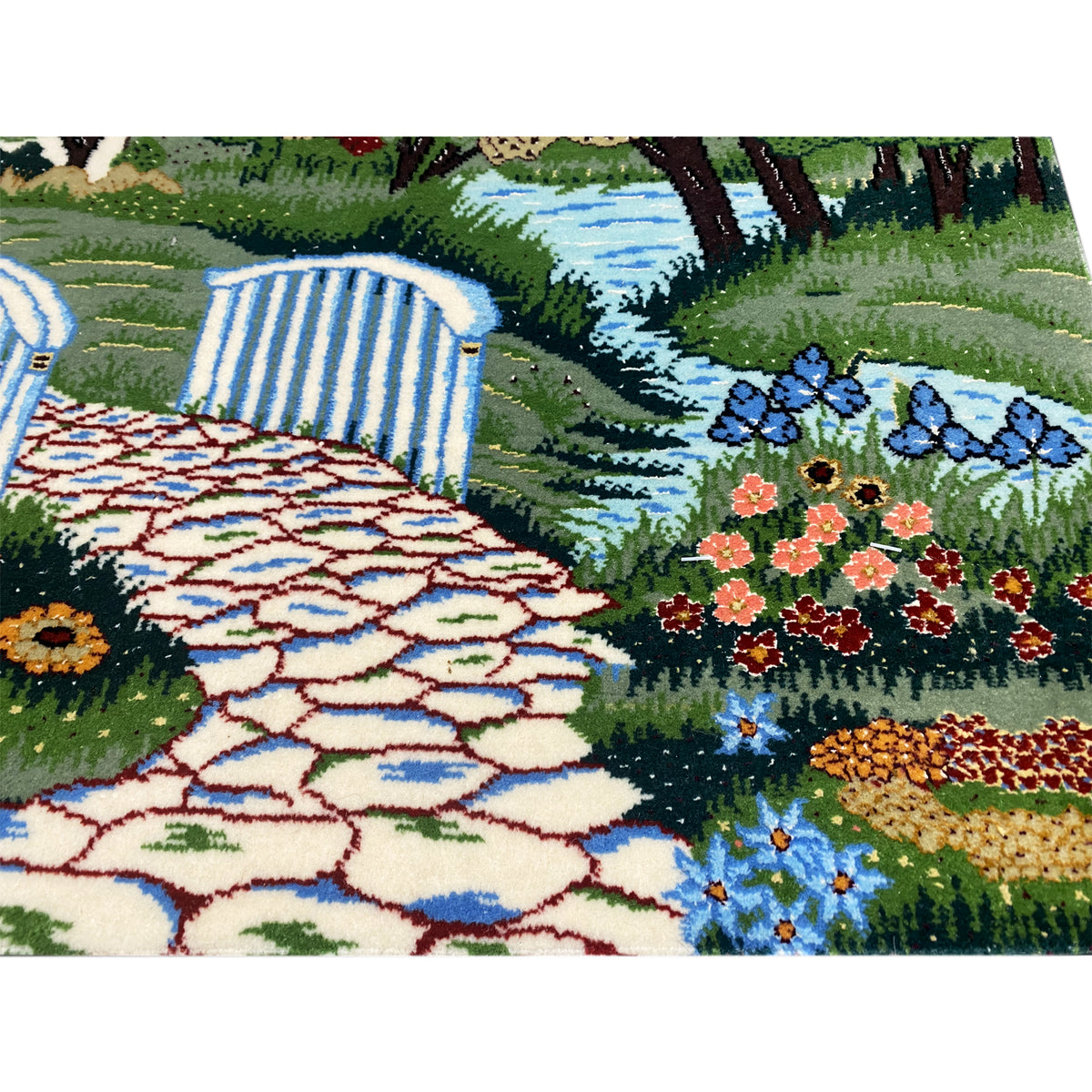Tapestry detail: paved path, flower beds, and blue water