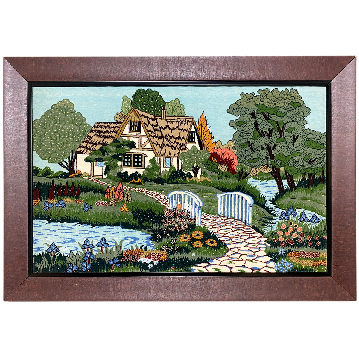 Tapestry depicting a house, gardens, and a river, framed, 85x54 cm