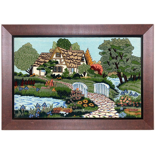 Tapestry depicting a house, gardens, and a river, framed, 85x54 cm