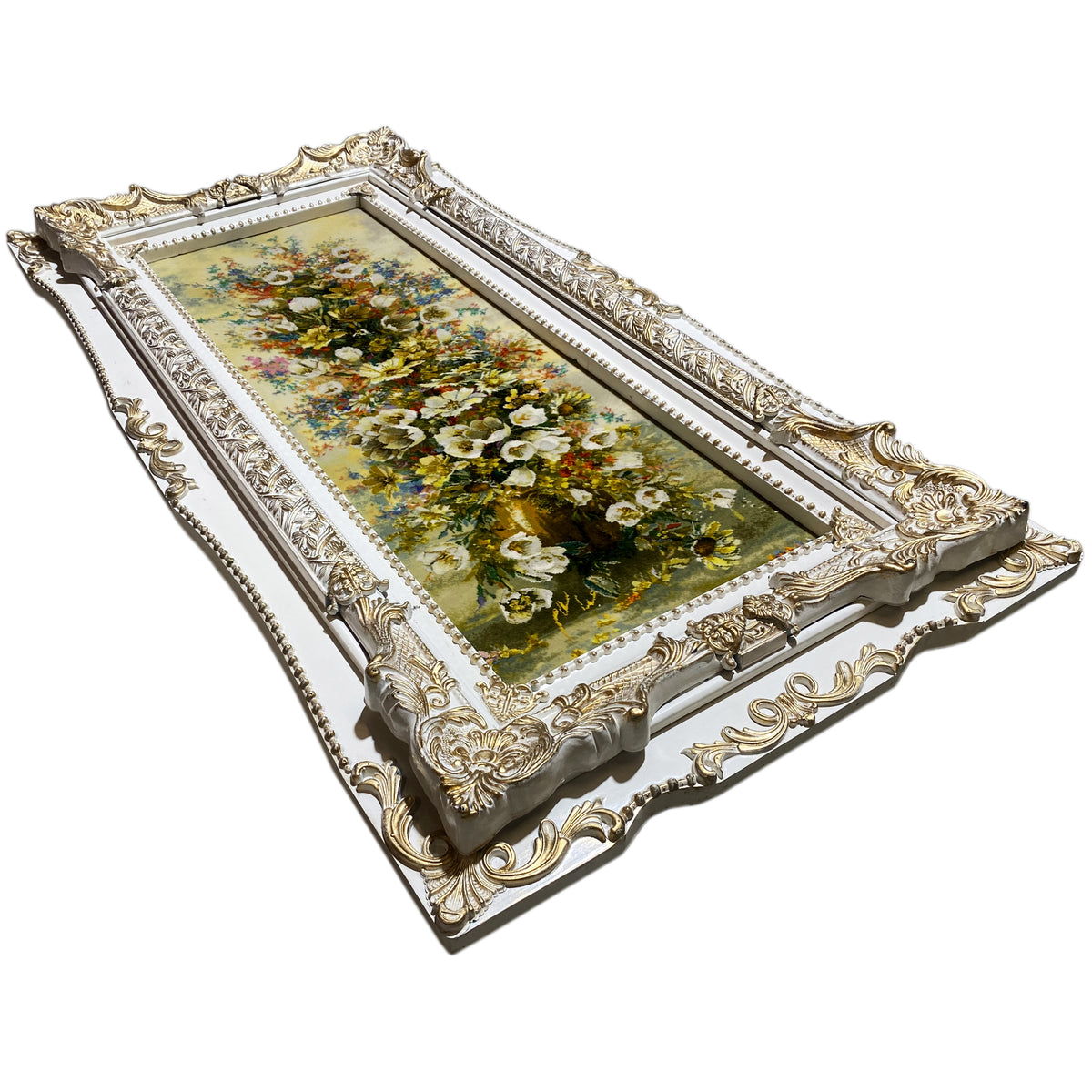 Tapestry with a floral image in an ornate gold-and-silver frame, angled.