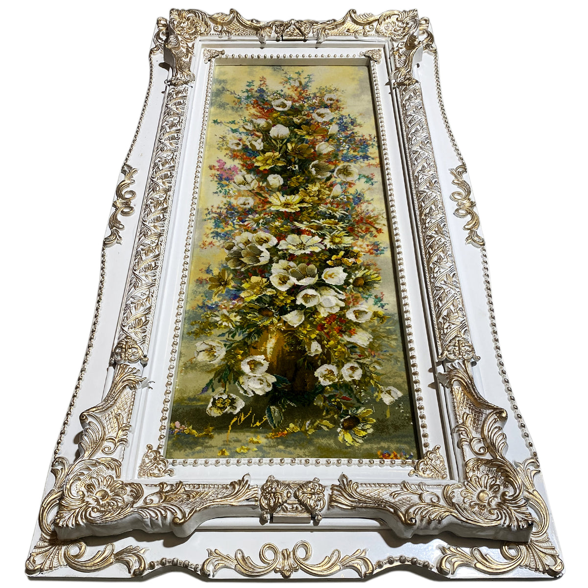 Floral tapestry in an ornate frame with hanging loops, 98x37 cm.