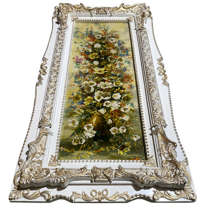 Floral tapestry in an ornate frame with hanging loops, 98x37 cm.
