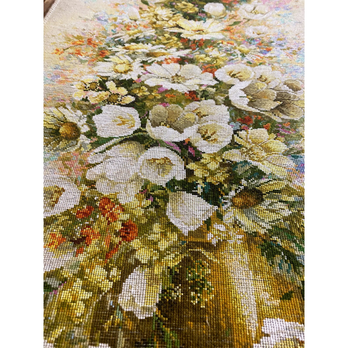 Tapestry with a floral motif as a woven texture, detailed close-up.