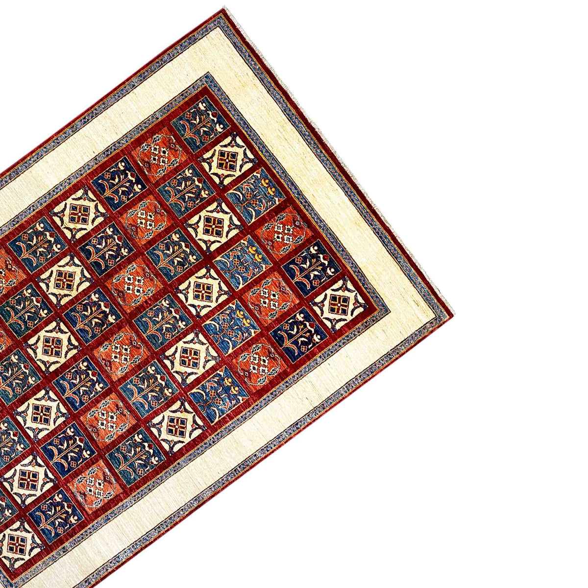 Khorjin rug corner with geometric floral squares in red, blue and cream