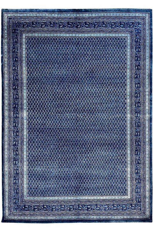 Square blue rug with a decorative border and fine texture