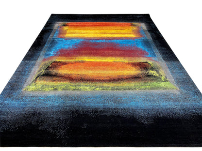 Designer rug with a wide color-block motif in orange and yellow, surrounded by blue