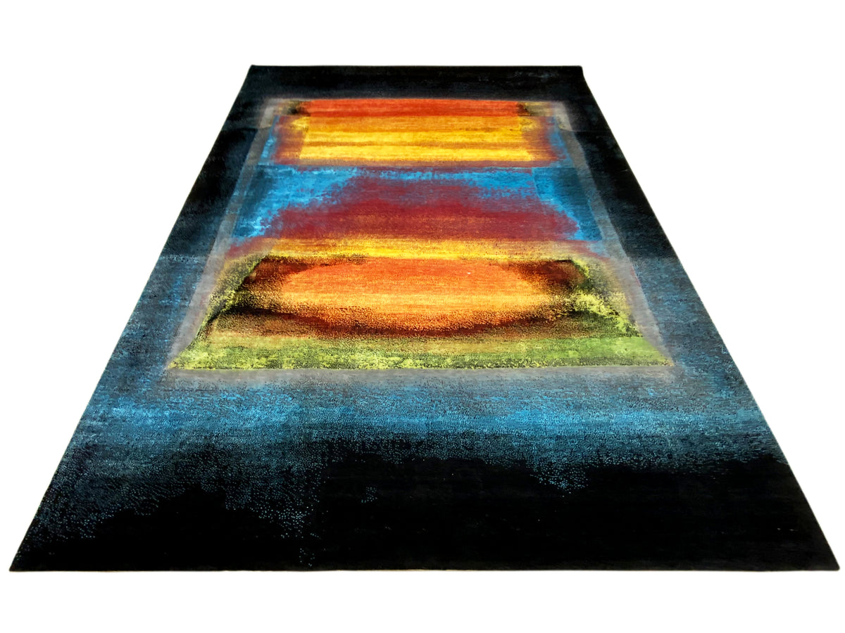 Abstract rug in dark blue with an orange-yellow central area and greenish accents