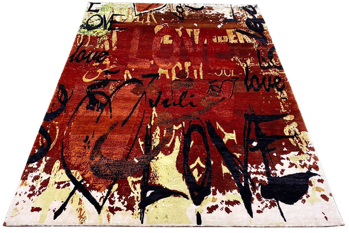 Rectangular rug with a graffiti look in reddish brown and dark blue with light speckles