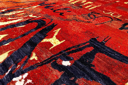 Rug with an abstract pattern, bold red with black lines and light accents