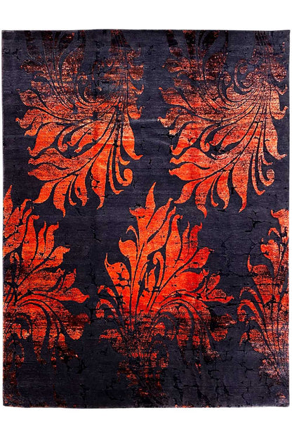 Rug with a dark background and a large-scale orange ornamental pattern, bordered edges.