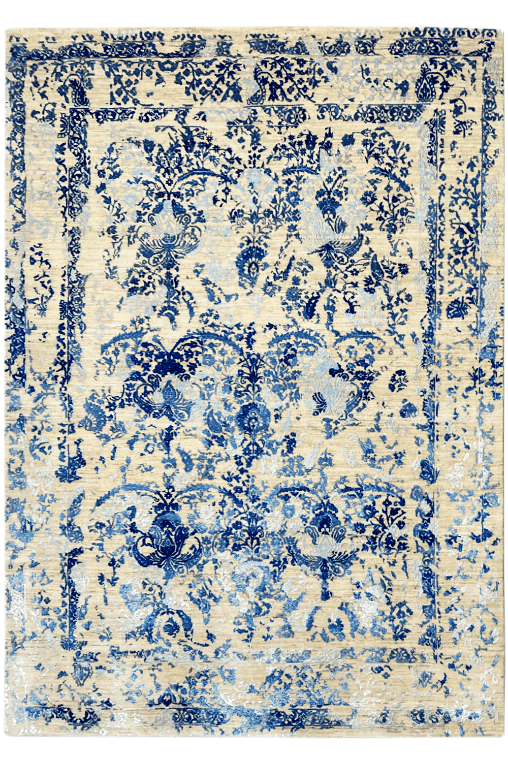 Rectangular rug with a blue floral pattern on a light background, with a decorative border