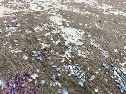 Carpet 185×122 cm close-up: vintage patches in purple, blue, and light gray.