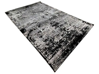 Diamond-cut rug: abstract black-and-white-gray pattern, dense pile