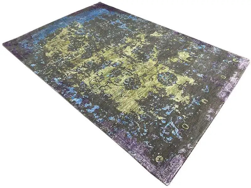 Designer rug diagonal: abstract patches in light green, blue, and violet on dark gray