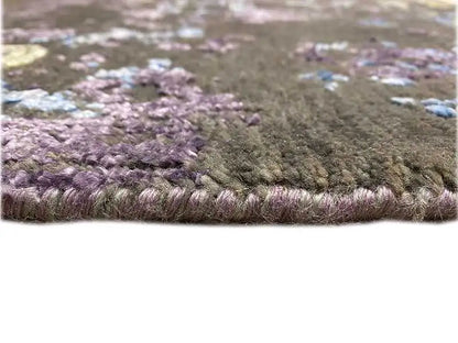 Designer rug pile detail: dense violet-brown with blue accents along the edge