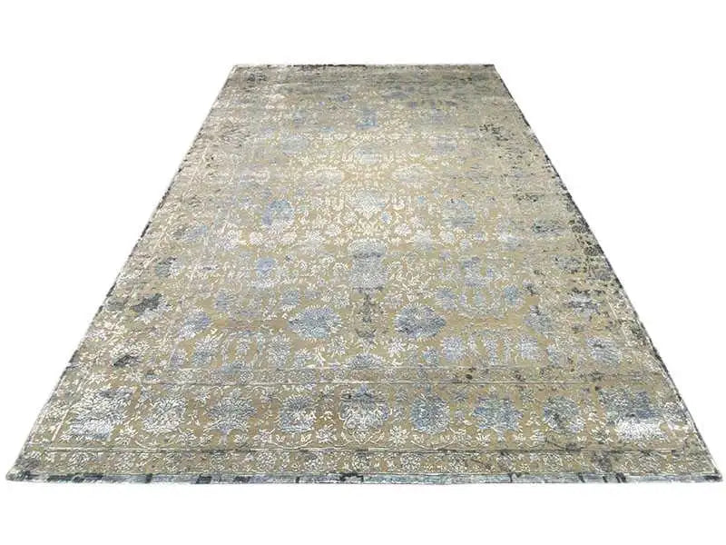 Rectangular designer rug: beige base with a blue-gray ornamental pattern, flat-weave