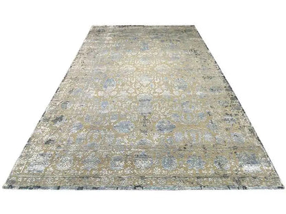 Rectangular designer rug: beige base with a blue-gray ornamental pattern, flat-weave