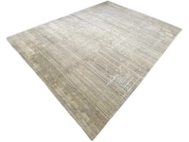 Rug at an angle with a light gray, mottled vintage look
