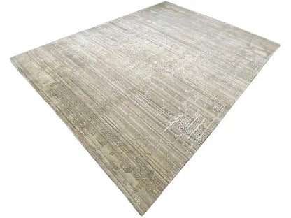 Rug at an angle with a light gray, mottled vintage look