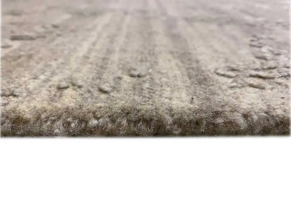 Carpet detail with a mottled pile surface in gray and light accents