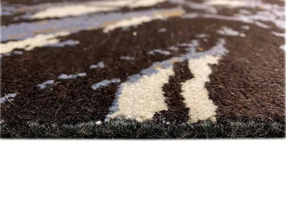 Designer rug detail: dark pile with white and light blue color blocks