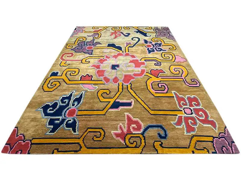 Rectangular designer rug with a beige background and colorful vine and cross patterns