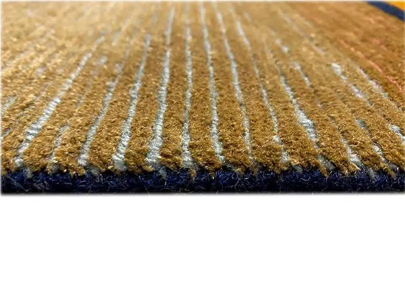 View of the designer rug: golden pile with fine white longitudinal stripes and a dark border