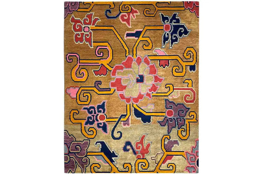 Square designer rug with an orange base and colorful cross patterns