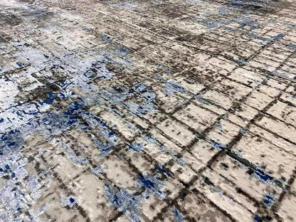 Carpet surface with a detailed grid, a beige-gray base, and scattered blue accents