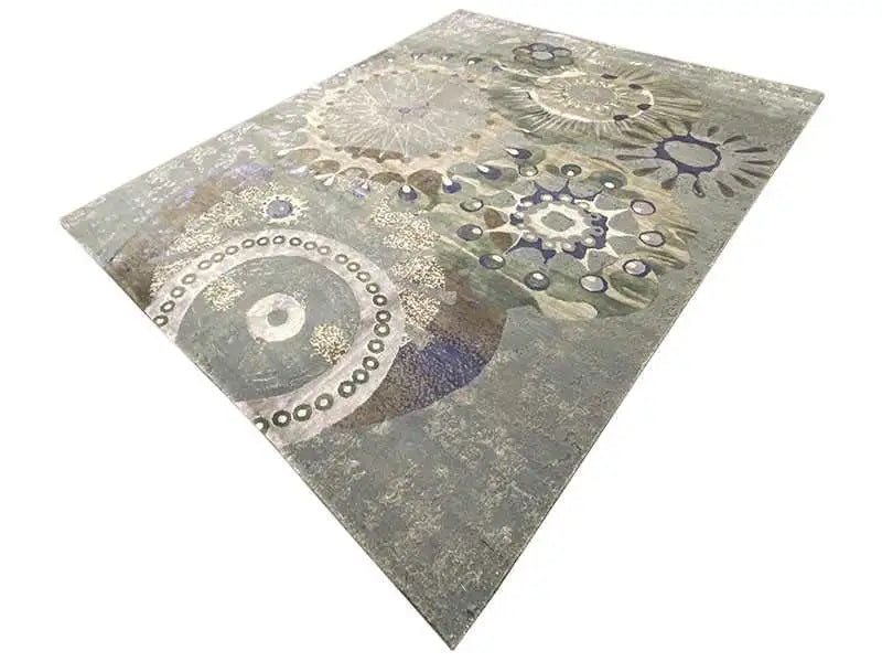 Square rug with geometric circular patterns in gray and blue