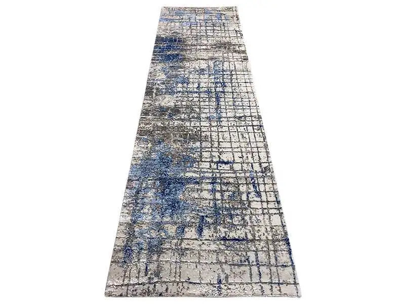 Roll carpet with an abstract grid pattern in light gray and blue