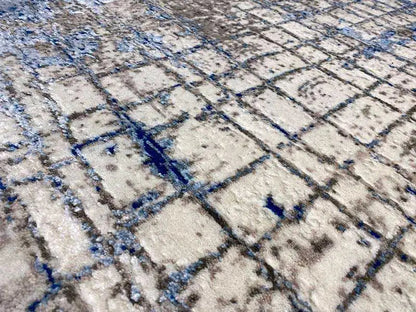 Close-up of the carpet: light grid with blue lines and dots