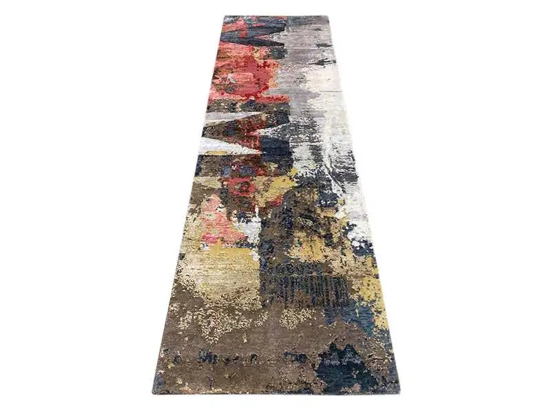 Long-pile vintage-style rug with a patchwork-like pattern in gray, blue, red, and yellow