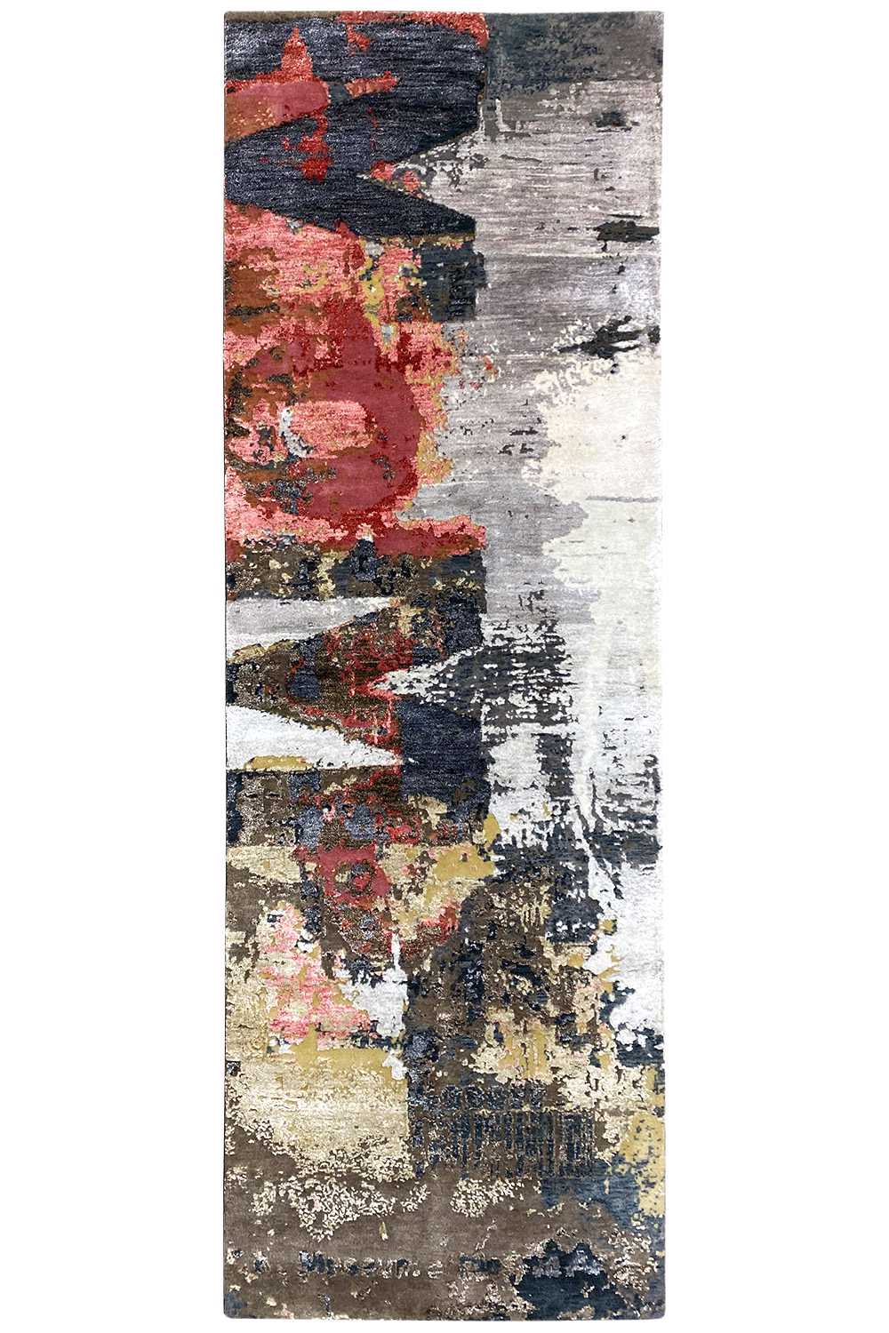 Rectangular rug with an abstract patchwork pattern and splashes of gray, dark blue, and red