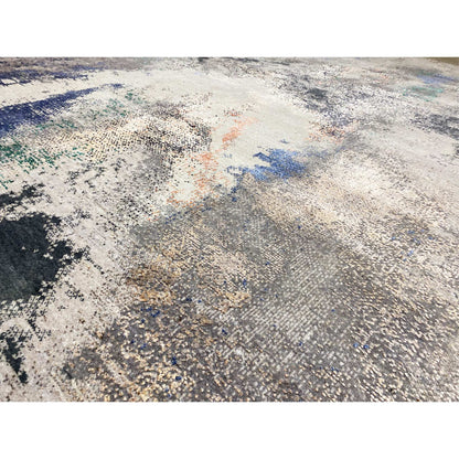 Abstract designer rug detail view: finely woven relief, beige/gray with blue